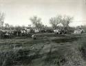 Untitled [Migrant Camp around a Muddy Track, Bakersfield, California], Vintage silver print, 1935.